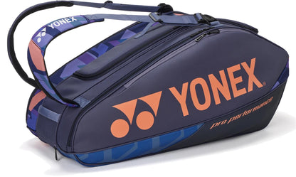 The Yonex 92429EX 9 Racket Pro Tennis Bag in Midnight Navy features multiple zippered compartments, Thermo Guard, a large side pocket, and adjustable shoulder straps—ideal for your tennis or badminton gear.