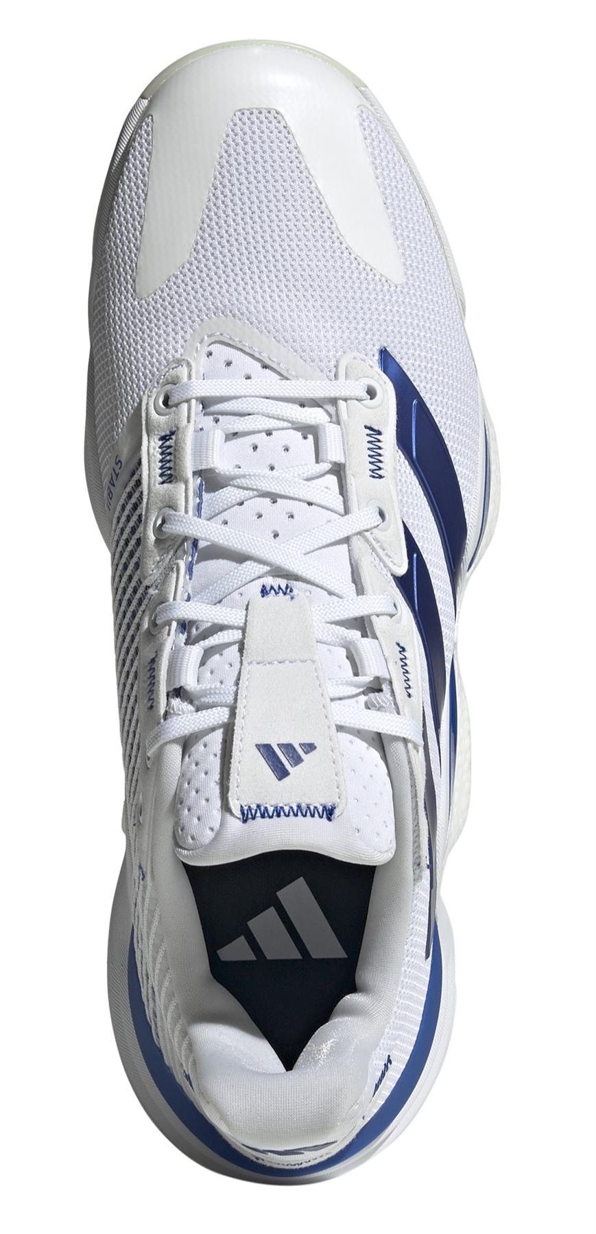 Top view of the ADIDAS Stabil 16 Men's Indoor Court Shoes in White/Blue, highlighting a BOOST midsole for comfort, mesh upper, lace-up design, and adidas logo on the tongue.
