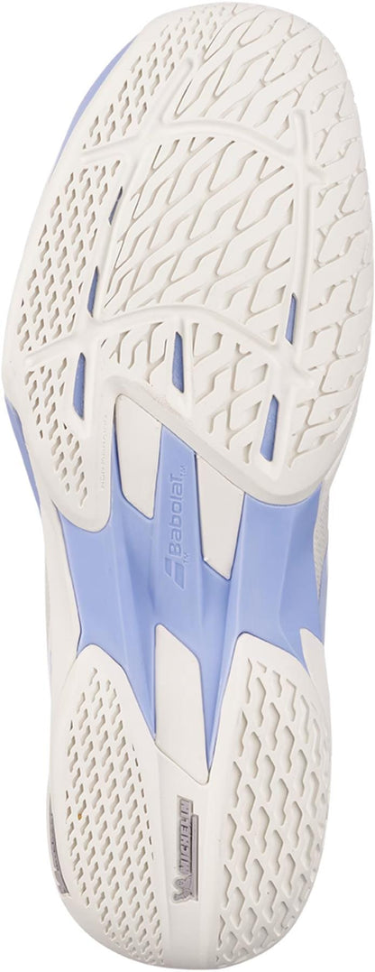 Close-up of the Babolat Jet Mach 4 All Court Women's Tennis Shoes in cream and lavender, highlighting the white textured sole with blue accents and geometric tread, engineered by Babolat for top agility and grip on any court.