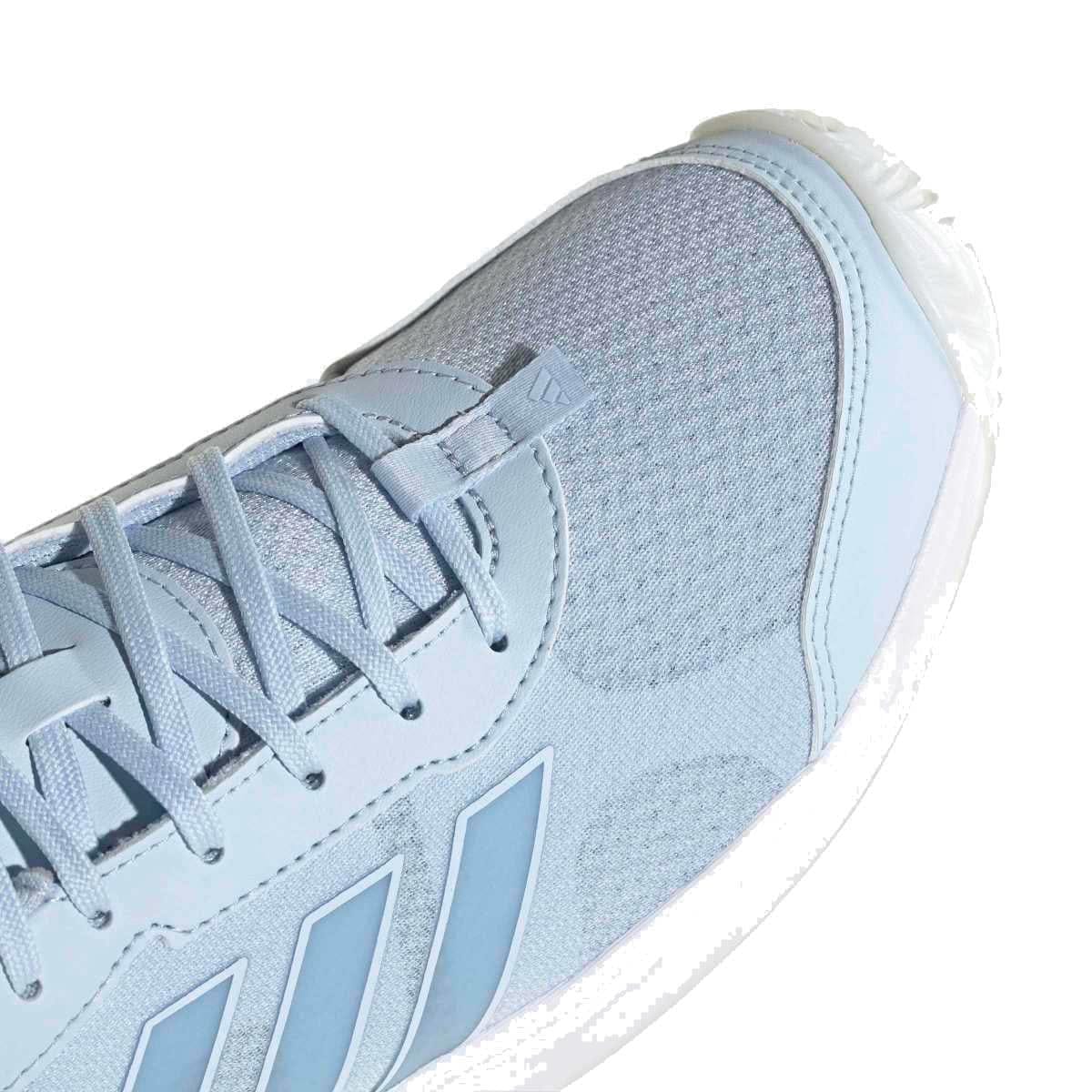Close-up of the ADIDAS AvaFlash Womens Tennis Shoes - Blue by adidas, featuring breathable mesh at the toe, stylish side stripes, laces, a lightweight build, textured rubber sole, and modern design.