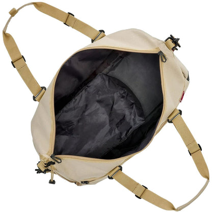 The Yonex BA72611EX Gearlogic Tennis Boston Bag in beige, made from recycled polyester, features a black lining and yellow adjustable straps. Shown from above with the main compartment open and empty.