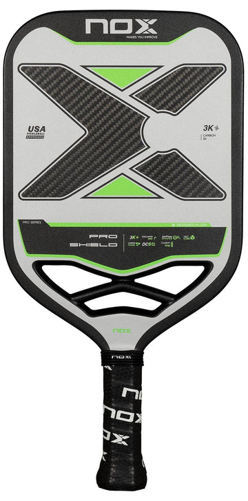 The NOX Pro Shield Pickleball Paddle by NOX features a large black and green "X" on its gray face, a black handle with grip tape, and advanced spin technology for improved performance.