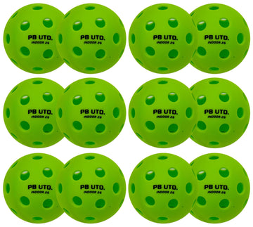 Twelve Pickleball United Freedom 26 Indoor Pickleball Balls in green, made of durable TPU with evenly spaced holes and “PB UTD. INDOOR 26” in black, are neatly arranged in a grid pattern.