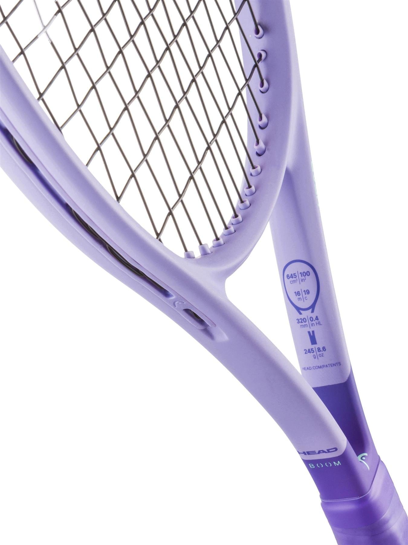 A close-up of the HEAD Boom Jr Alternate 2026 Junior Tennis Racket focuses on its strings and throat area, showcasing technical details and emphasizing HEAD's advanced Hy-Bor technology inside the junior racket frame.