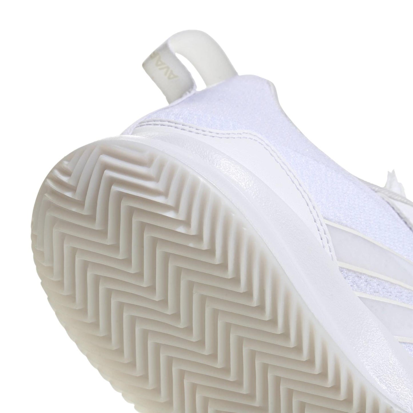 Close-up of the sole and side of the ADIDAS AvaFlash Women’s Tennis Shoes in white by adidas, highlighting the herringbone tread pattern and part of the heel tab with embossed text.