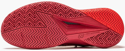 Close-up of the bright red outsole on the Yonex Power Cushion Eclipsion 5 Womens Tennis Shoes, showing a zigzag herringbone tread and textured details, plus embossed branding for superior grip. Brand: Yonex. Color: Ruby Red.