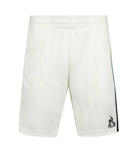 Le Coq Sportif Pro Mens Tennis Shorts in Marshmallow feature breathable fabric, an elastic waistband, subtle side stripes, and a black logo on the lower left leg. Ideal for tennis players, shown on a white background.