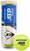 A Dunlop ATP Tour Tennis Balls 3 Ball Tube with blue and white branding stands upright next to a vibrant yellow ball, designed for elite play and trusted by ATP Tour professionals.