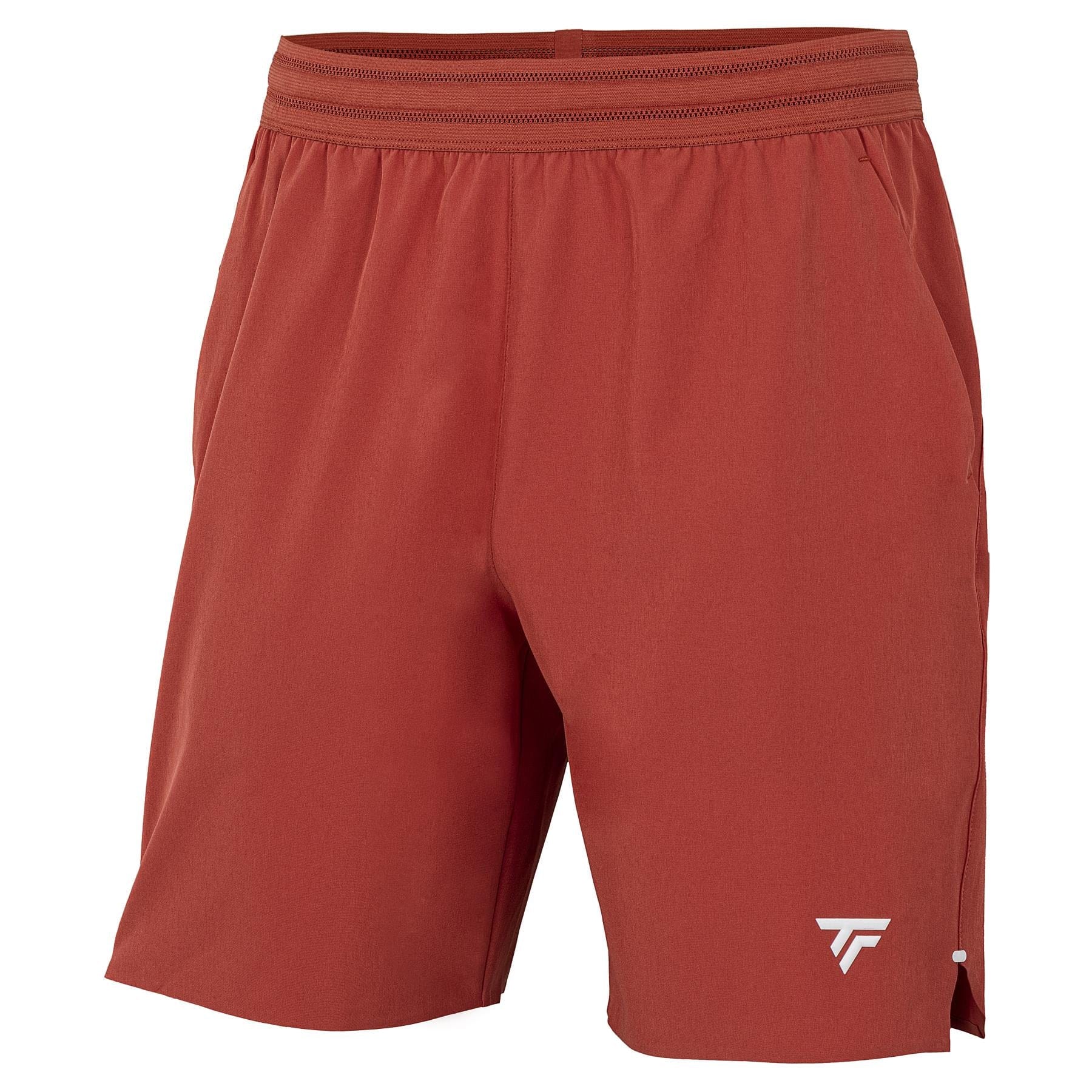 The Tecnifibre Team Stretch Mens Tennis Shorts in Terracotta feature an elastic waistband, side pockets, and a small white logo on the lower left leg. Lightweight and versatile, they’re perfect for both sports and casual wear.