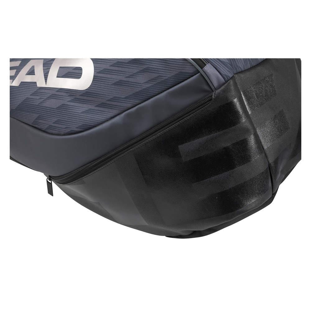 Close-up of the HEAD Djokovic Monstercombi 12R tennis racket bag in anthracite and black, highlighting its textured surface and a partial "EAD" logo. Equipped with CCT+ climate control technology, it features a zippered side compartment designed for Novak Djokovic's gear.