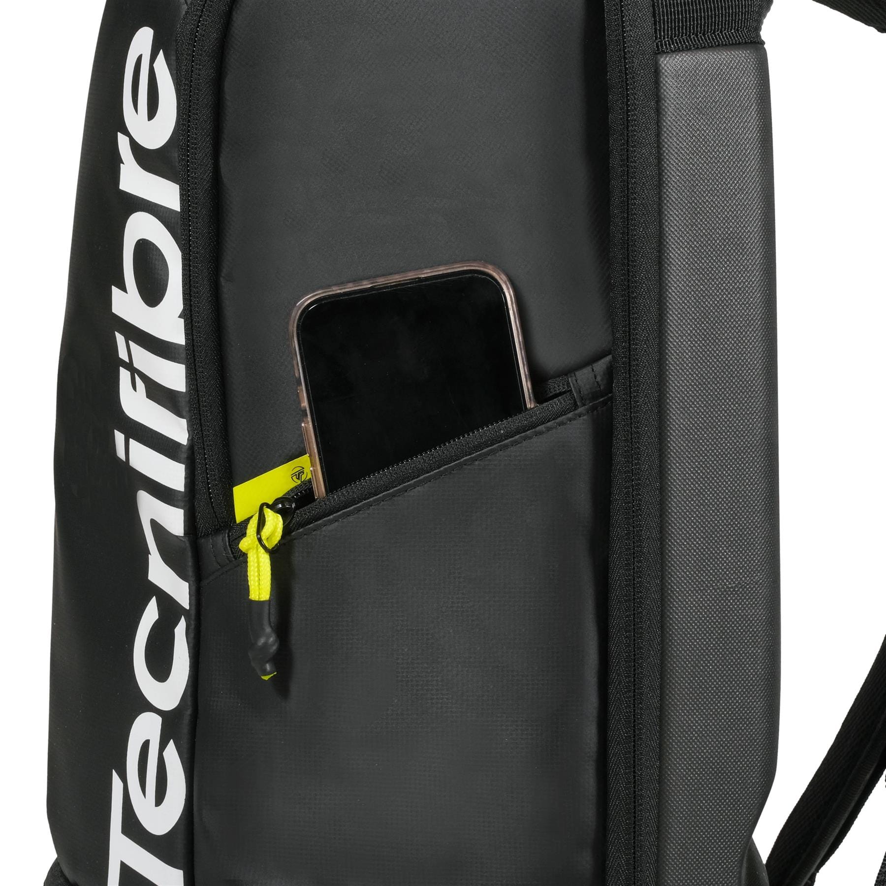 A close-up of the black Tecnifibre Reform Tennis Backpack with a side zipper pocket, partially open to show a smartphone inside. The white Tecnifibre logo appears on this stylish and functional tennis racket bag.
