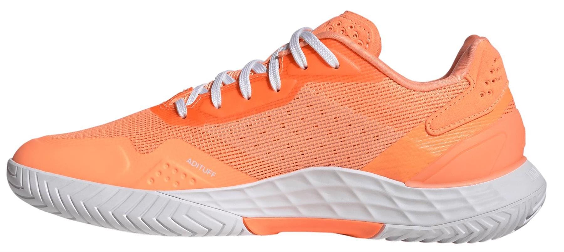 The adidas ADIDAS Defiant Speed 2 Womens Tennis Shoes in bright orange feature white laces, a textured white sole, mesh panels, and a low-cut design for lightweight comfort, shown from the side on a plain white background.