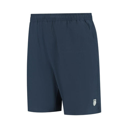 Product Description: The K-Swiss Hypercourt Men's 7 Inch Tennis Shorts in Peacoat feature a plain dark blue design, complete with an elastic waistband and deep pockets. A small K-Swiss logo is subtly placed near the hem on one leg. Crafted from 4-way stretch fabric, these shorts are lightweight and ideal for both sports and casual wear.