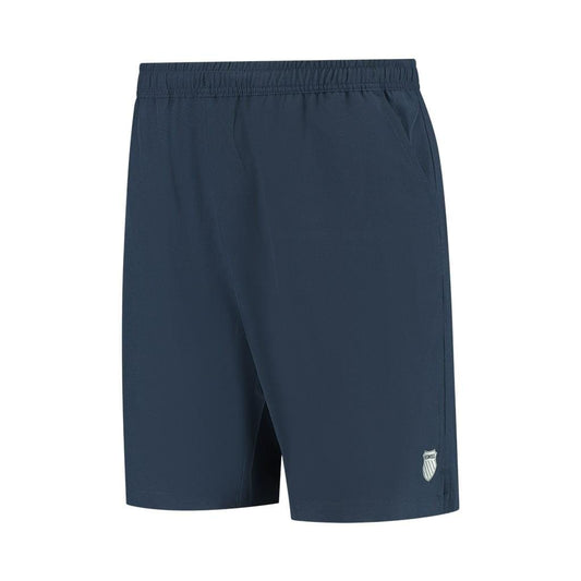 Product Description: The K-Swiss Hypercourt Men's 7 Inch Tennis Shorts in Peacoat feature a plain dark blue design, complete with an elastic waistband and deep pockets. A small K-Swiss logo is subtly placed near the hem on one leg. Crafted from 4-way stretch fabric, these shorts are lightweight and ideal for both sports and casual wear.