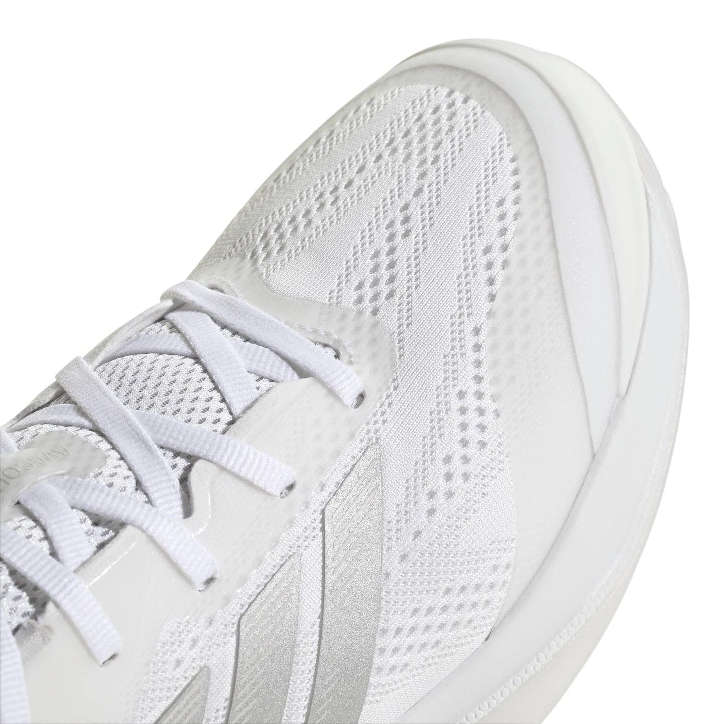 Close-up of the adidas ADIDAS Avacourt 3 Womens Tennis Shoes in white, featuring mesh and synthetic overlays for breathability and support, with white laces and textured fabric details—designed for women’s tennis courts.