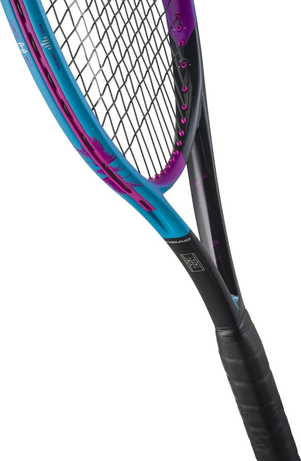 Close-up of two overlapping tennis rackets, featuring the HEAD Radical MP Palm Tree Crew Tennis Racket by HEAD in black, pink, and blue with tightly woven strings for a modern and colorful look.