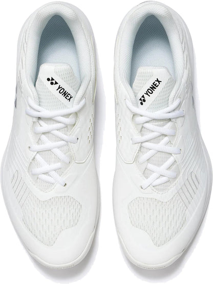 The Yonex Power Cushion Sonicage Wide Unisex Tennis Shoes in white feature breathable mesh panels, white laces, and the Yonex logo on the tongue—offering lightweight style and comfort for every match.