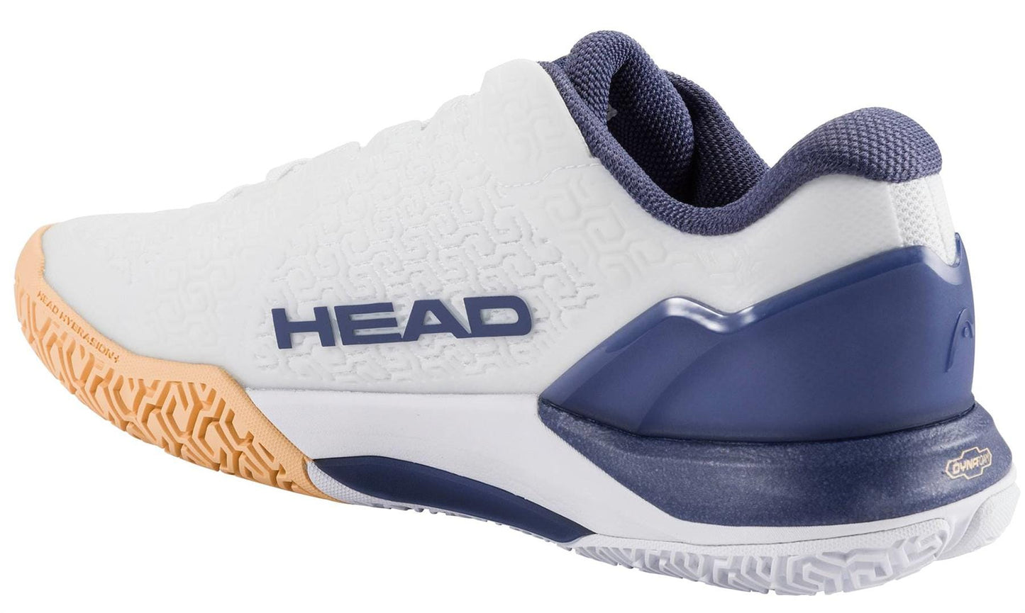The HEAD Revolt Pro 5.0 Womens Tennis Shoes in White/Apricot feature a textured sole, cushioned heel, orange outsole accents, and the HEAD logo on the side, offering the durability ideal for women's tennis shoes.
