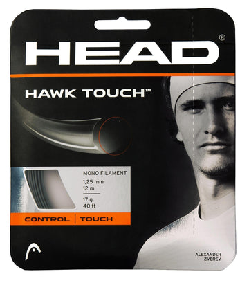 The packaging of the HEAD Hawk Touch Tennis String Set in Anthracite Grey displays a black and white image with string specifications, including its monofilament construction, 1.25 mm diameter, 12 m length, 17 g weight, and 40 ft length. Emphasizing "CONTROL" and "TOUCH," it incorporates Crystal Core Technology to enhance performance.