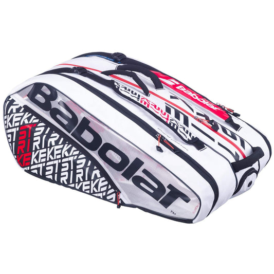 A stylish Babolat RH12 Pure Strike 12 Racket Tennis Bag in white, black, and red, designed with insulated compartments for optimal storage of your tennis equipment. Featuring bold "Babolat" branding on the side, this modern bag is perfect for all your tennis gear needs.