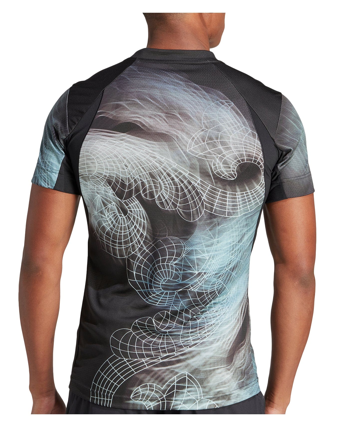 A person is wearing the adidas Men's Printed Aeroready Freelift Pro Tennis T-Shirt in black, featuring a complex geometric and swirling digital art design in shades of black, gray, and white on the back. This shirt is made from recycled polyester and incorporates HEAT.RDY technology to keep you cool.