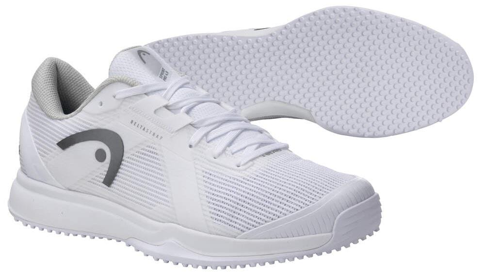The HEAD Sprint Pro 4.0 Mens Grass Court Tennis Shoes in White/Grey feature textured soles, gray logo accents, and an Ortholite® Insole; shown with one shoe upright and the other displaying the sole pattern.