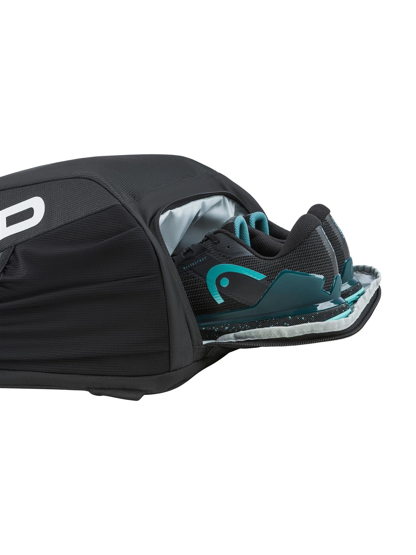 A close-up of the HEAD Tour 25L Tennis Backpack - Black by HEAD, showing its partially unzipped ventilated compartment with a pair of black and teal athletic shoes inside.