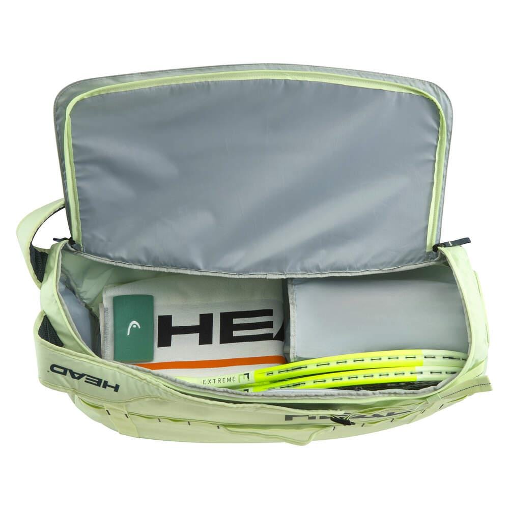 Open tennis bag showcasing two neon yellow racquets from the EXTREME racket series and a folded HEAD Pro Duffle Tennis Bag M - LLAN; interior is lined with light gray material.