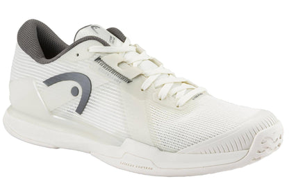 The HEAD Sprint Pro 4.0 Men's Tennis Shoes in Chalk White/Dark Grey feature a breathable mesh upper, white laces, gray accents, and a side logo—ideal for sports or casual wear.