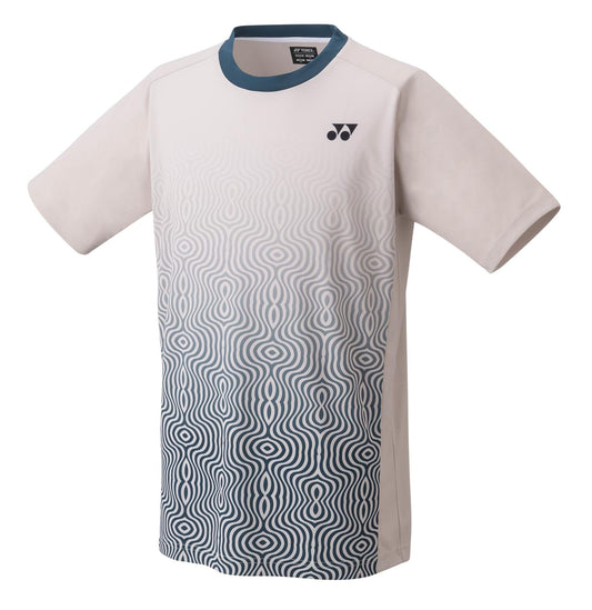 The Yonex 16693EX Men's Tennis T-Shirt, available in oatmeal, features a distinctive abstract wave pattern and transitions from blue to white. With short sleeves and a small chest logo, this shirt ensures comfort on the court through its sweat-absorbent properties.