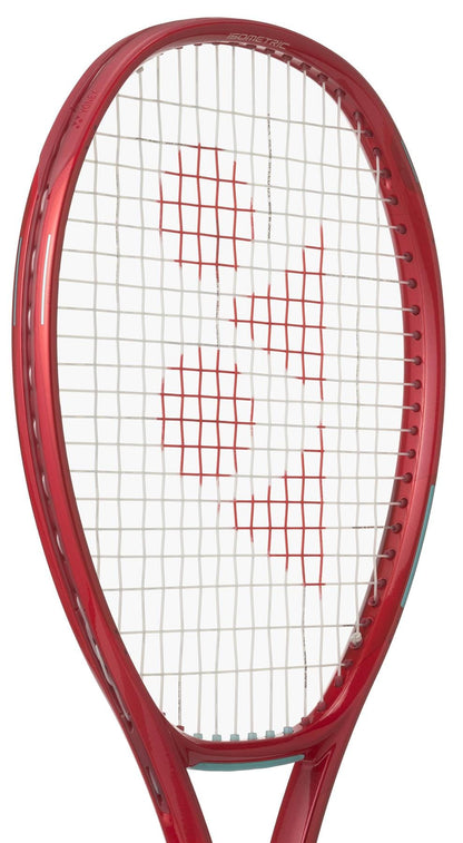 The Yonex VCORE 95 2026 Ruby Red Tennis Racket is shown angled from the front with white strings and a red logo pattern, designed for maximum spin, displayed against a white background.