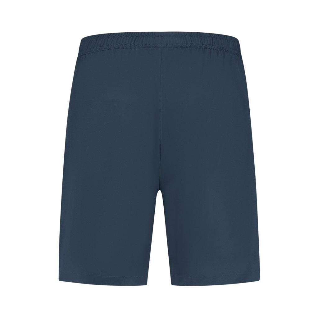 The K-Swiss Hypercourt Men's 7 Inch Tennis Shorts in Peacoat feature deep pockets and an elastic waistband, showcased against a white background. These shorts boast a simple design with 4-way stretch for ultimate comfort and flexibility, all without any visible logos or embellishments.