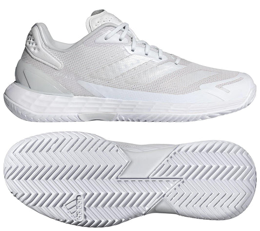 Two views of the adidas Defiant Speed 2 Women’s Tennis Shoes in white: the side shows breathable mesh and synthetic uppers, while the bottom view reveals a lightweight build with a textured herringbone sole for grip.