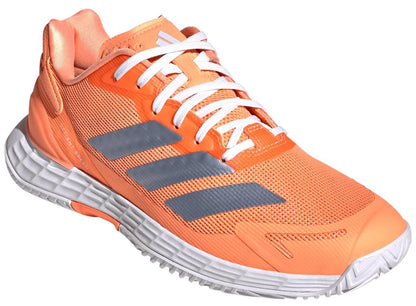 The ADIDAS Defiant Speed 2 Womens Tennis Shoes in orange by adidas are shown angled on a white background—ideal for those seeking lightweight tennis footwear.
