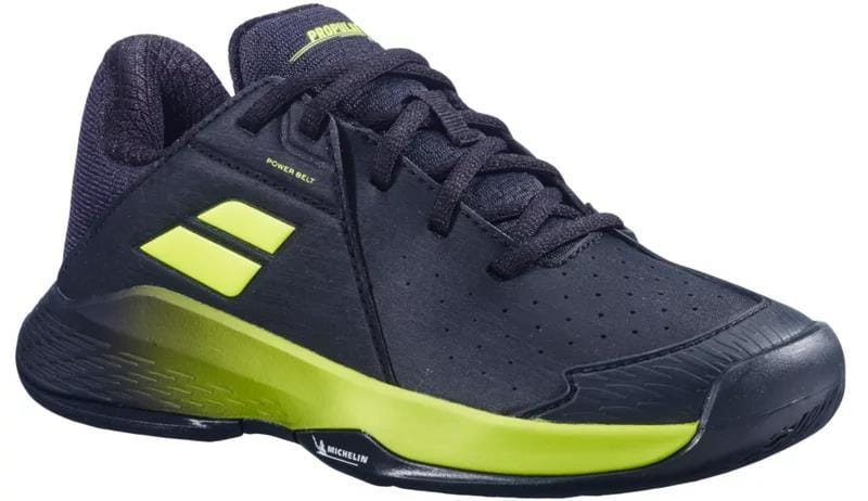 The Babolat Propulse Junior 3 All Court Boys Tennis Shoes – Black/Aero features neon yellow accents, side slits, black laces, a low-cut design, and a durable Michelin outsole with synthetic and mesh materials. Brand: Babolat.