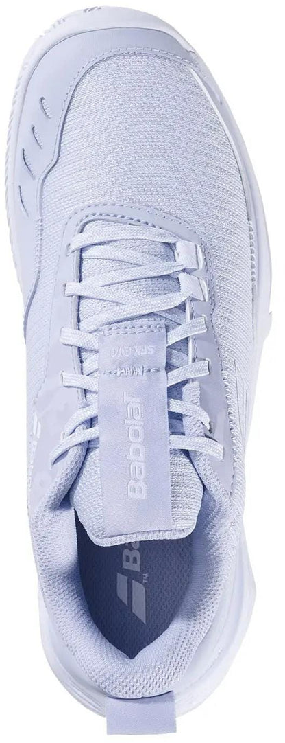 A top view of the Babolat SFX Evo Carpet Women's Tennis Shoes in Xenon Blue/White, featuring a wide fit, mesh and synthetic materials, lace-up design, and "Babolat" branding on the tongue and side.