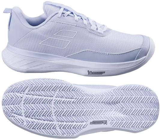 A pair of Babolat SFX Evo Carpet Women's Tennis Shoes in Xenon Blue/White, shown from the side and bottom, feature a mesh upper, laces, and a textured rubber sole with a herringbone pattern for wide-fit comfort.