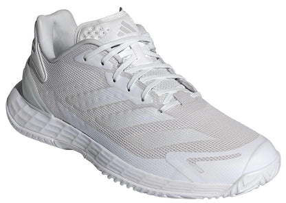 The ADIDAS Defiant Speed 2 Womens Tennis Shoes in white feature mesh uppers, a lace-up closure, and a textured sole—lightweight and perfect for women who want style and performance on the court.