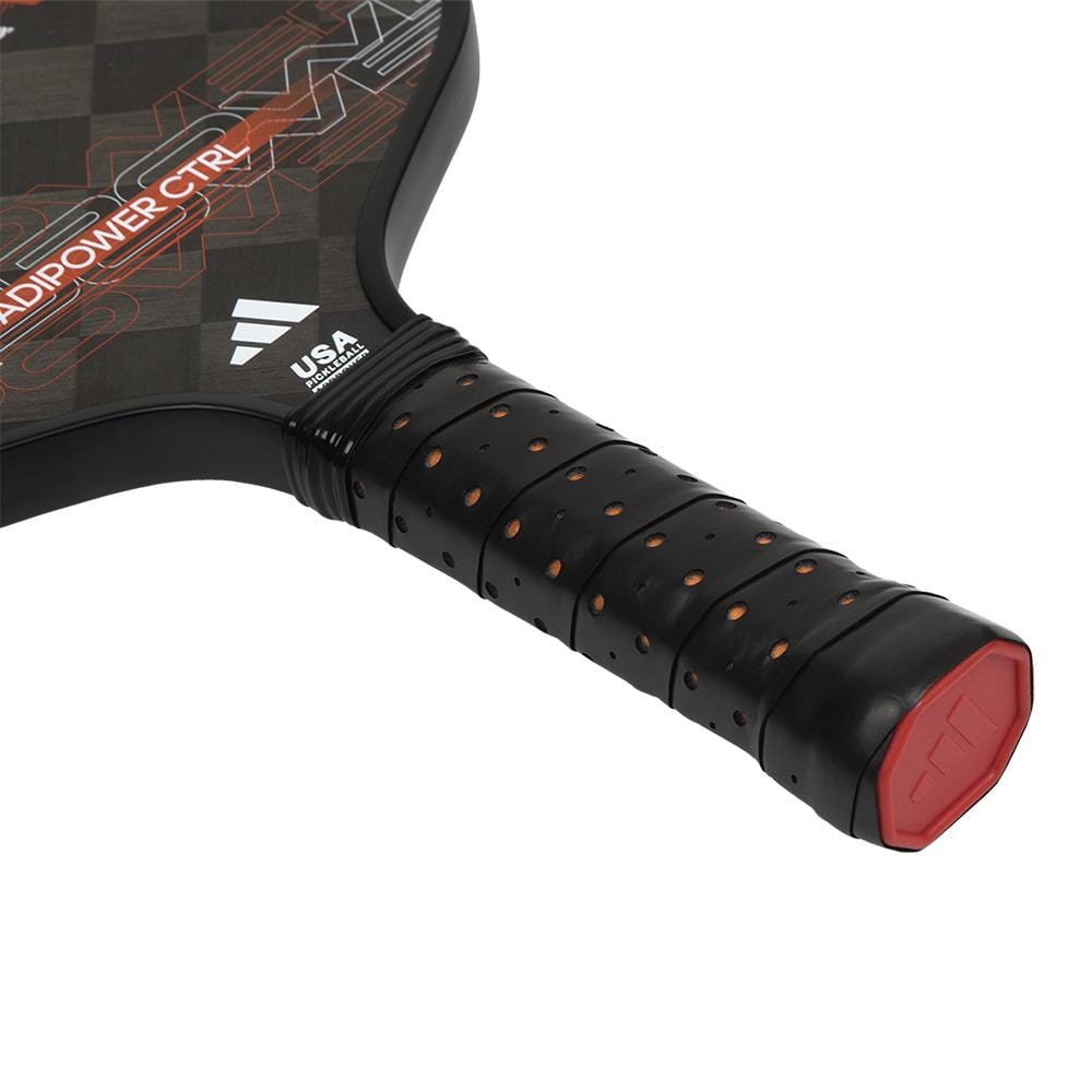 Close-up of the adidas ADIDAS Adipower CTRL 3.3 Pickleball Paddle handle, featuring a black perforated grip, red end cap, and part of the black/orange design with "RAPIDPOWER CTR" text inspired by the Adipower CTRL 3.3 series.