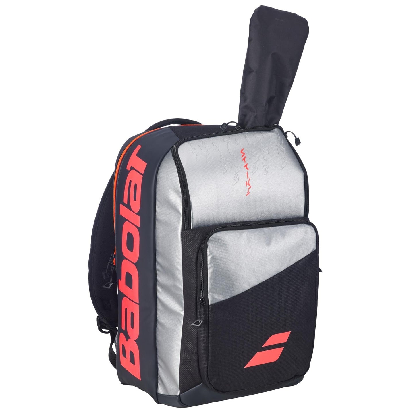 The Babolat Pure Strike Tennis Backpack - Carbon Grey features gray, black, and red accents, a visible tennis racquet in the rear compartment, multiple zippered pockets, and a large Babolat logo on the side.