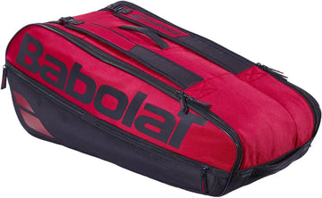 The Babolat Court L 9 Racket Tennis Bag in Burgundy and Black is crafted from recycled polyester and features a large logo, multiple zippered compartments, and convenient handles—designed to carry racquets and sports gear.