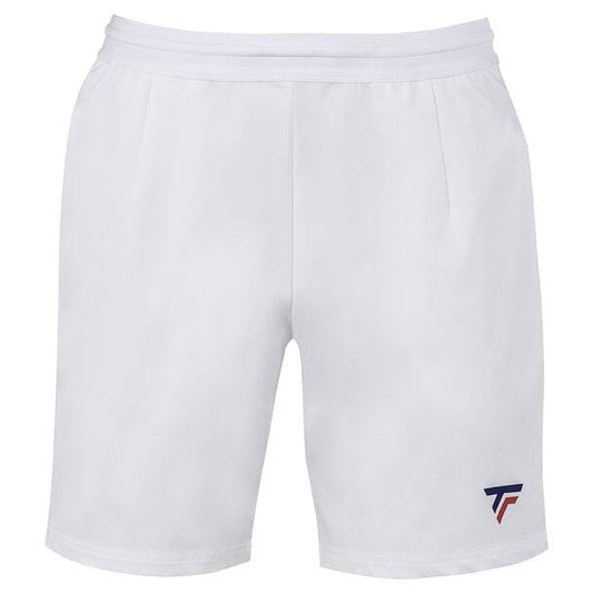 The Tecnifibre Men's Team Tennis Shorts in white are crafted from breathable fabric, providing both lightness and elasticity. These athletic shorts feature a plain white design with a small blue and red logo located in the bottom left corner.