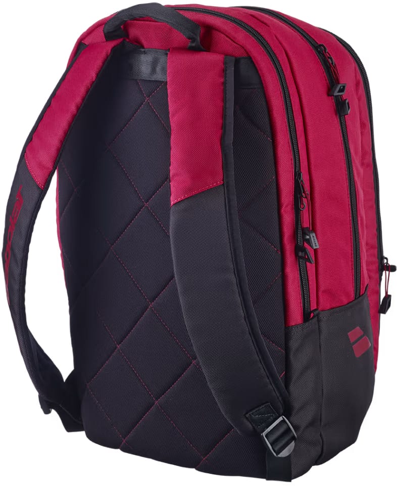 Babolat Court Hero Tennis Backpack in burgundy and black features a quilted back panel, padded shoulder straps, multiple zip compartments, and a bottom chest strap clip—crafted by Babolat from recycled polyester for both style and sustainability.