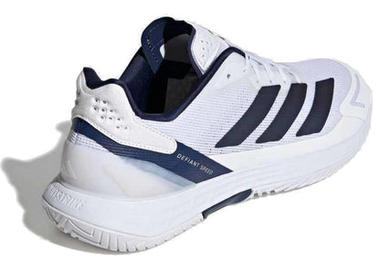 The adidas Defiant Speed 2 Men’s Tennis Shoes in white and navy feature three black side stripes, a textured sole, and "DEFIANT SPEED" near the heel. This lightweight shoe is shown on a white background.