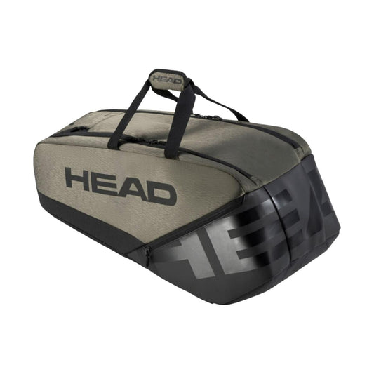 The HEAD Pro X Tennis Bag L - TYBK, endorsed by Novak Djokovic, prominently showcases the HEAD brand name. This tennis bag is available in olive green and black and includes two carry handles along with several zippered compartments. It also features CCT+ Climate Control Technology to safeguard your equipment.