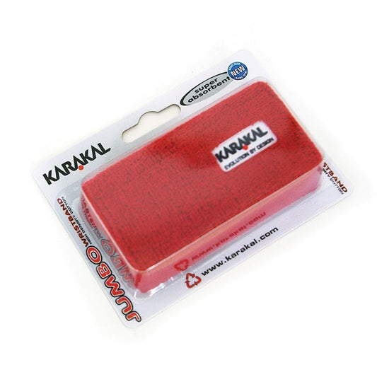 A Karakal red jumbo wristband is attractively packaged with visible branding, highlighting its highly absorbent cotton features. The packaging includes a website URL at the bottom for additional information.