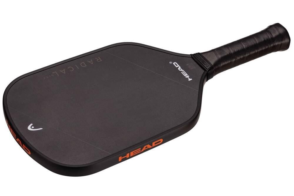 The HEAD Radical Nite Pickleball Paddle - Black features a textured SpinFusion surface, the HEAD logo on the face and edge, and a wrapped black handle.