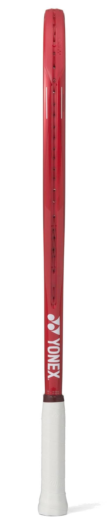 The Yonex VCORE 25 Junior Ruby Red 2026 Tennis Racket is shown upright from the side, with a white grip and the white Yonex logo displayed on the shaft.