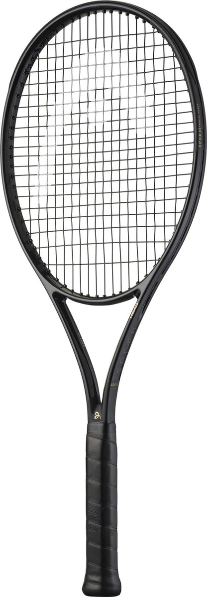 The HEAD Speed Pro Legend 2025 Tennis Racket by HEAD, in black and gold with a wrapped grip and strung oval head—similar to Novak Djokovic's racket—is displayed against a white background.