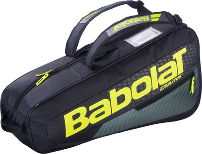 The Babolat RH Carlitos Junior 3 Racket Tennis Bag in black and yellow features bold yellow Babolat branding, two handles, and a zippered compartment—ideal as a kids tennis bag for junior players.
